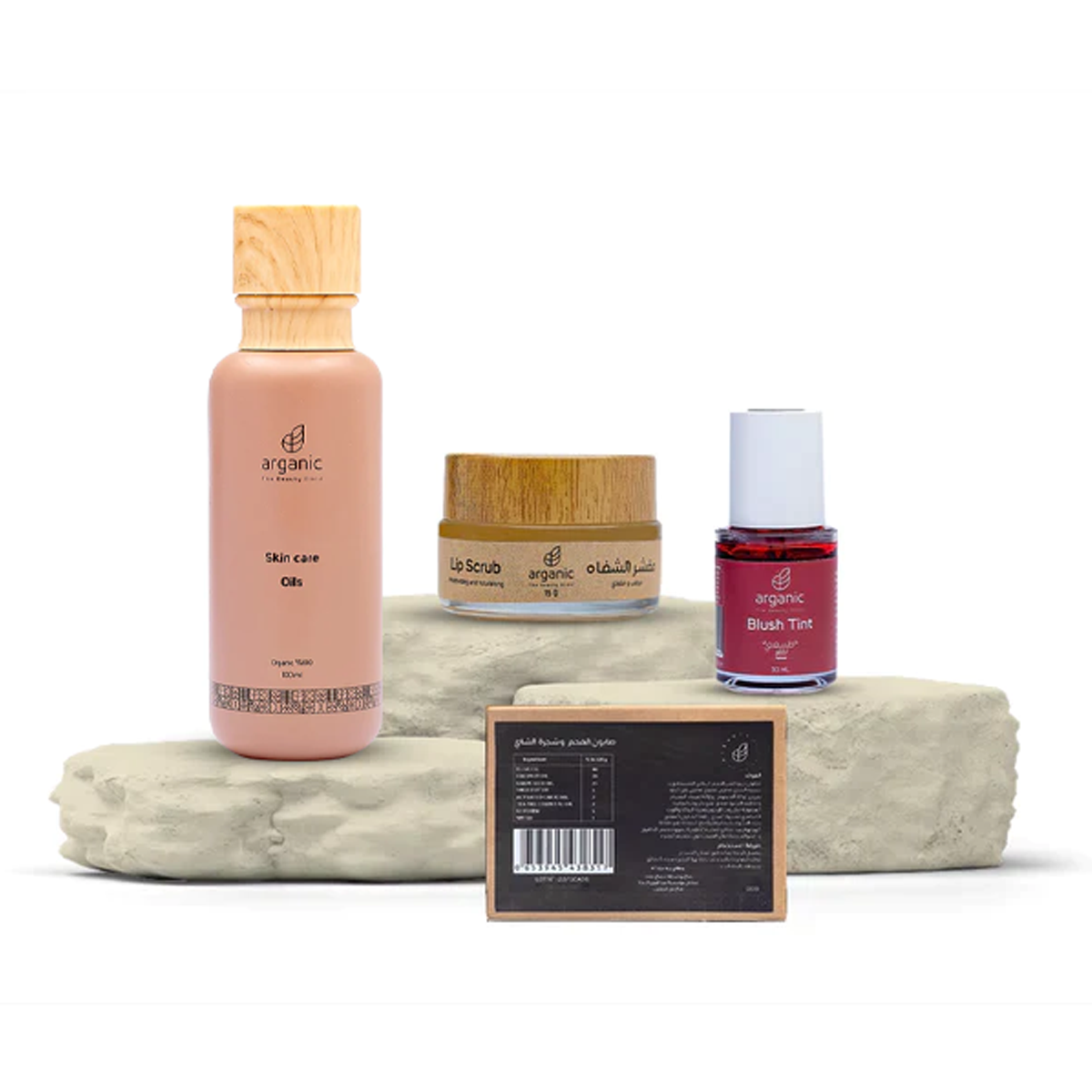 Artisanal skincare set with argan oil and red blush tint.