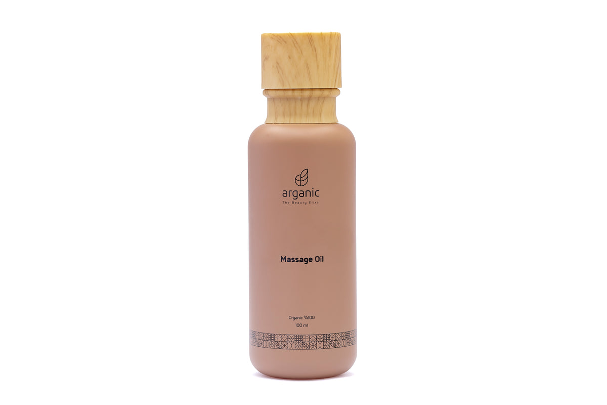 Organic massage oil bottle with wooden cap, beige label on white.