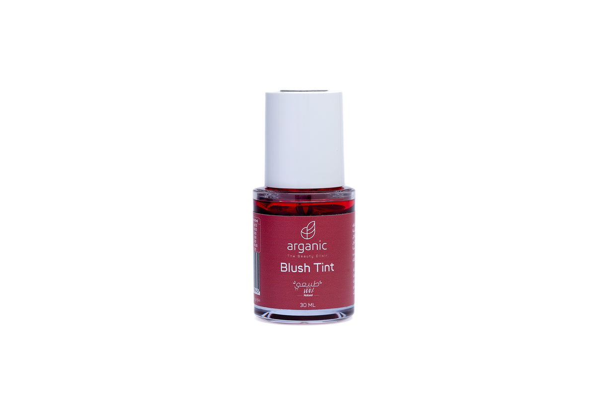 Organic red blush tint in a glass bottle, white cap isolated on white.
